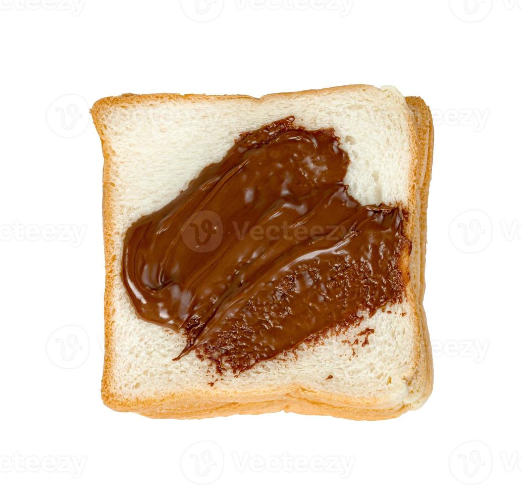 Toasted slice bread with chocolate spread isolated on white background photo