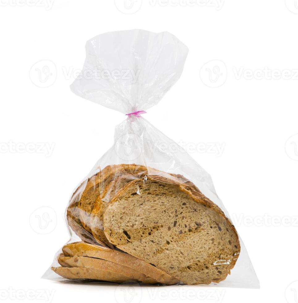 closeup bread loaf in plastic bag isolated on white background photo