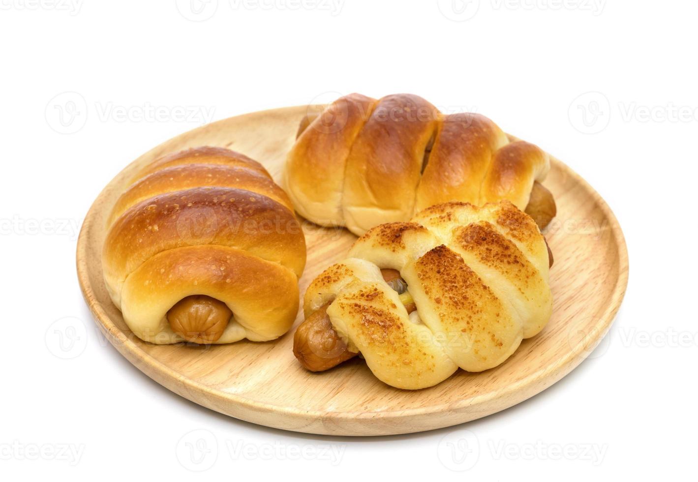 Cheese Sausage bread on wooden dish ,isolated on white background photo