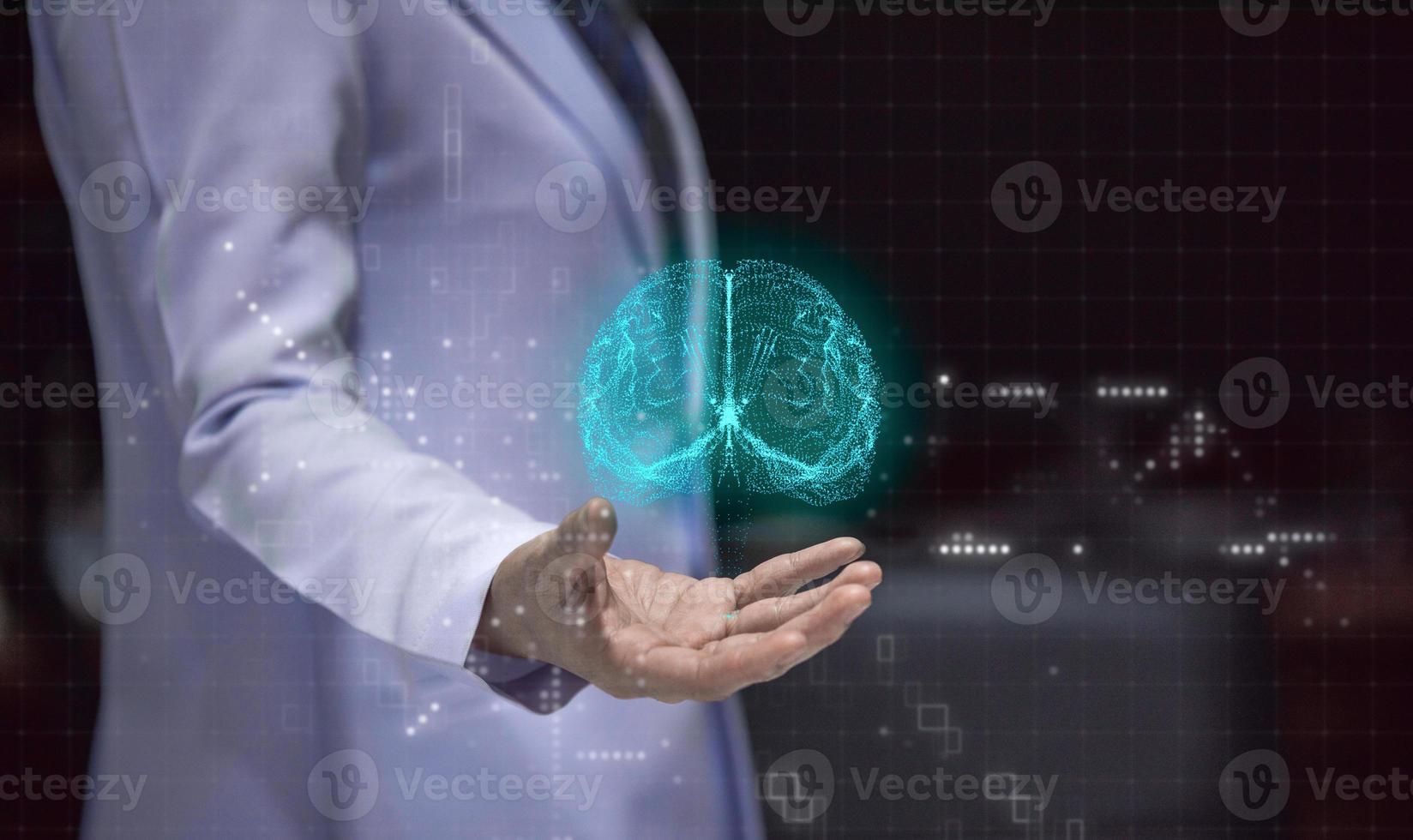 Woman doctor holding hand with holographic brain, stoke prevention concept photo