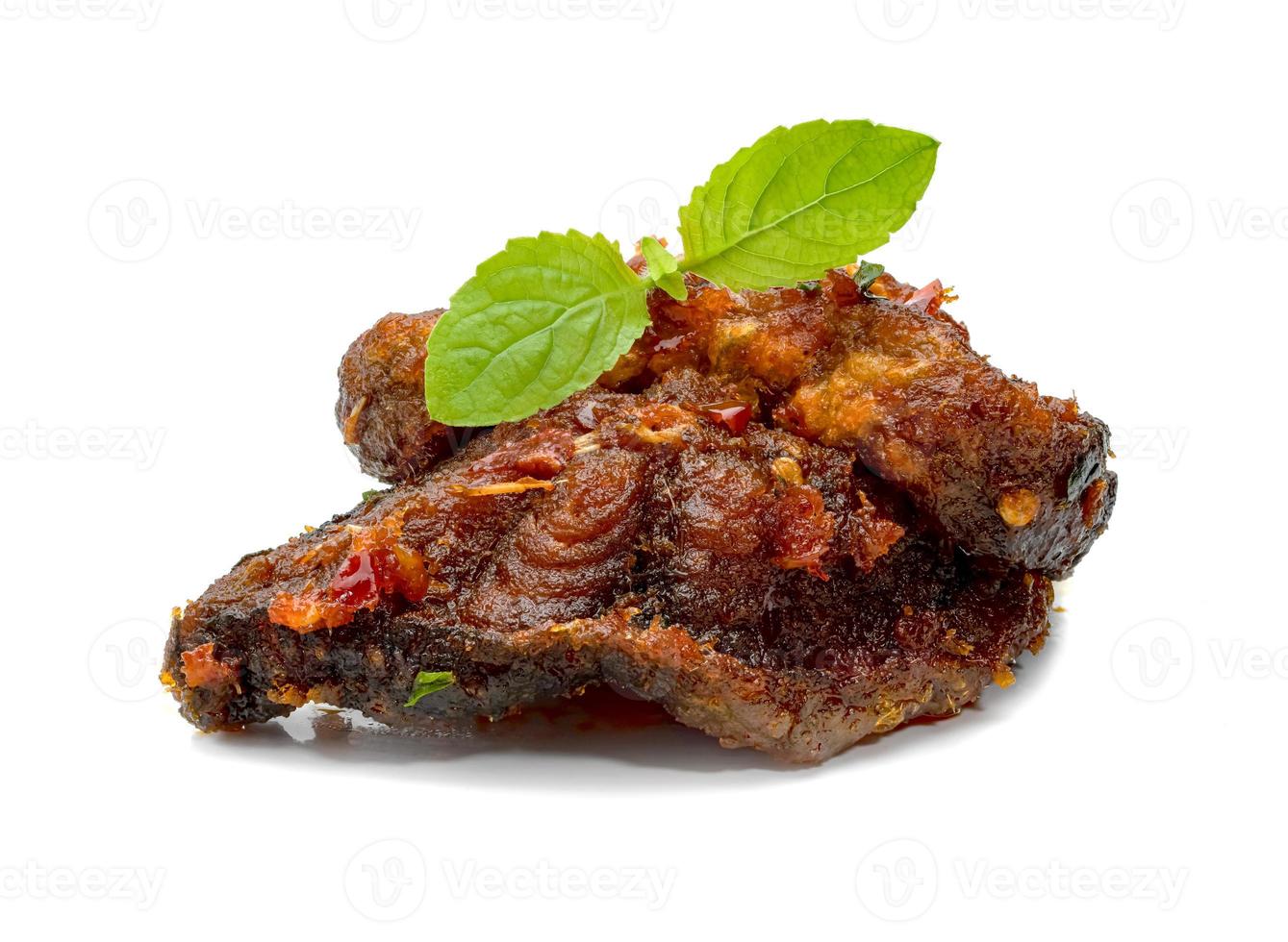 Stir Fried Crispy Catfish with Curry and leaf  fresh basil isolated on white background photo