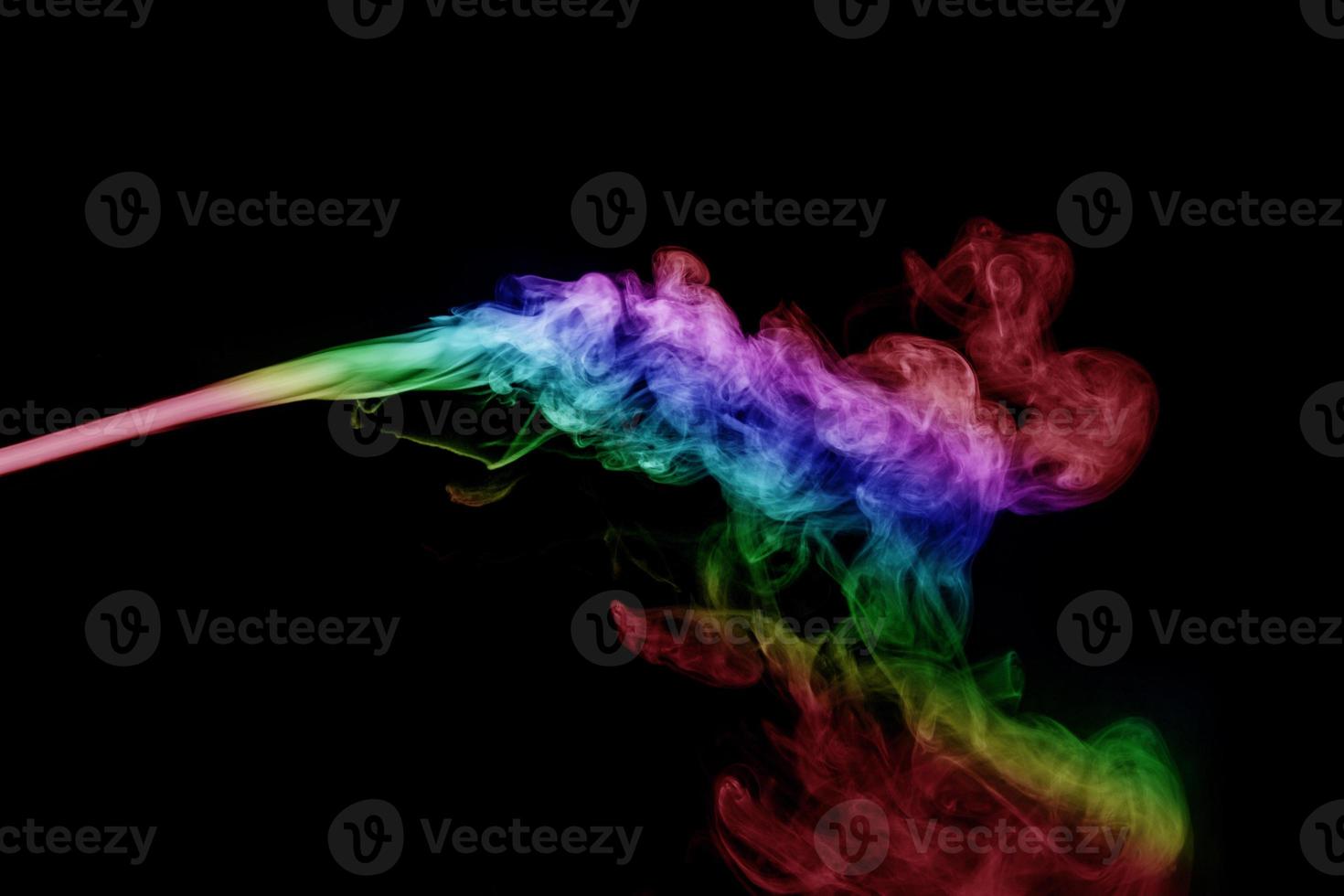 Abstract smoke isolated on black background,Rainbow powder photo