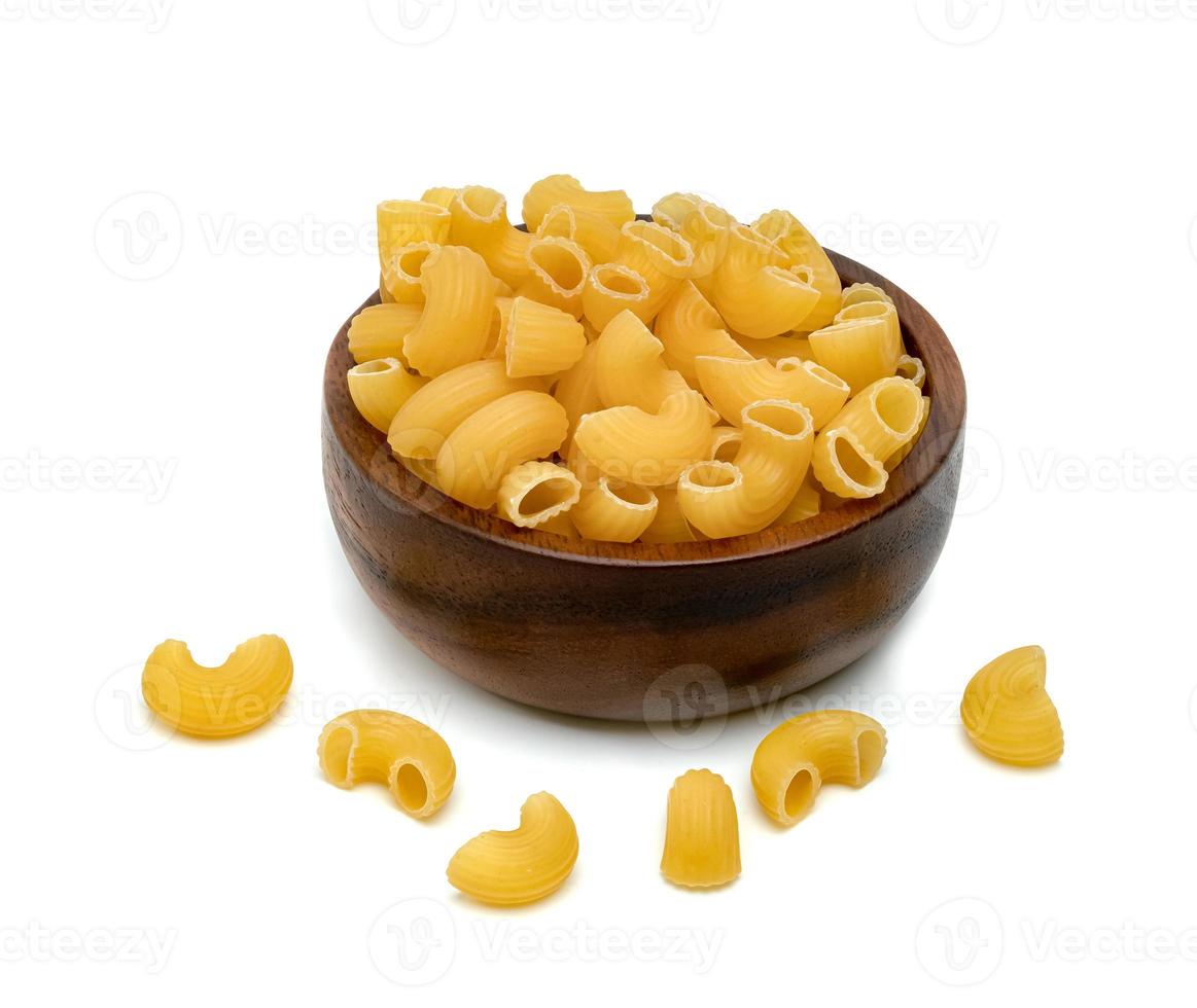 raw macaroni pasta with wooden bowl isolated on white background photo