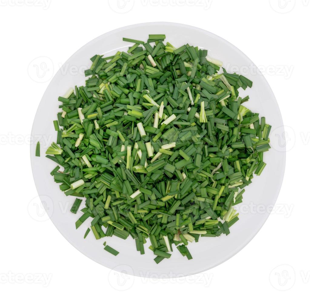 Chop up the garlic chive on white dish,top view,isolated on white background photo