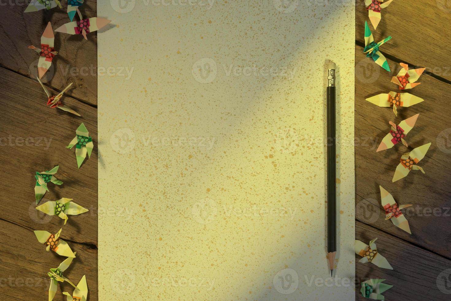 A sheet of paper with a pencil on wooden office desk photo