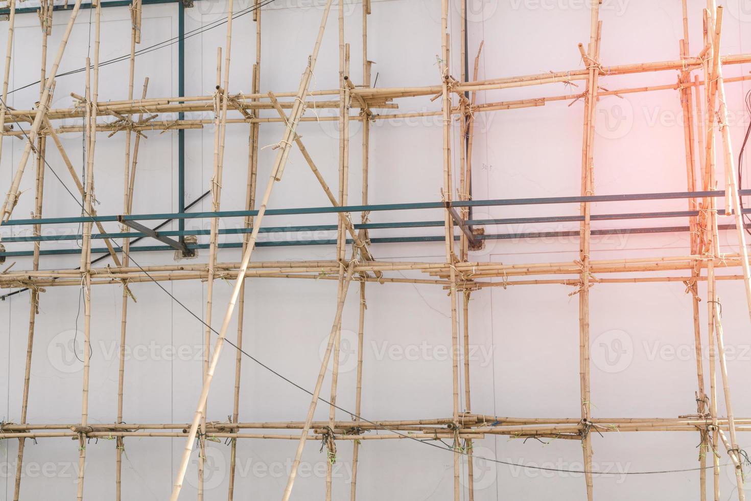 scaffolding at construction with wooden bamboo photo