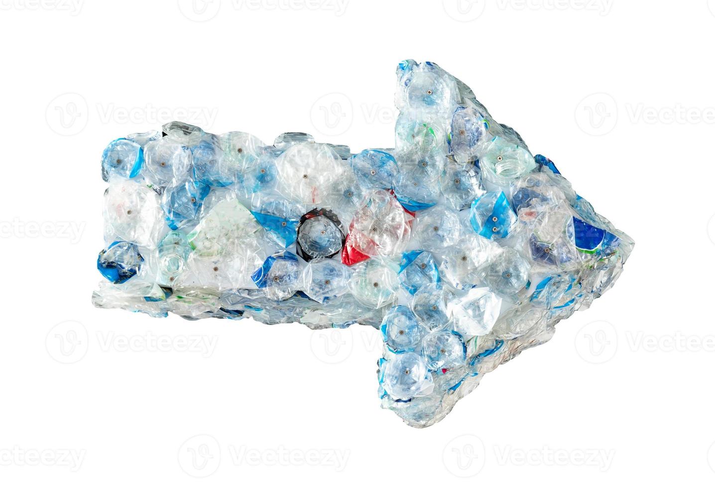 Plastic waste as arrow shape isolated on white background photo