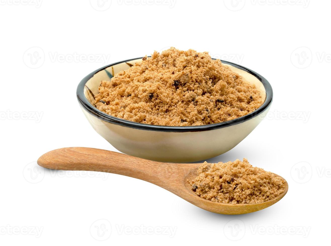 Brown cane sugar pile with wooden spoon and ceramic bowl on white background ,include clipping path photo