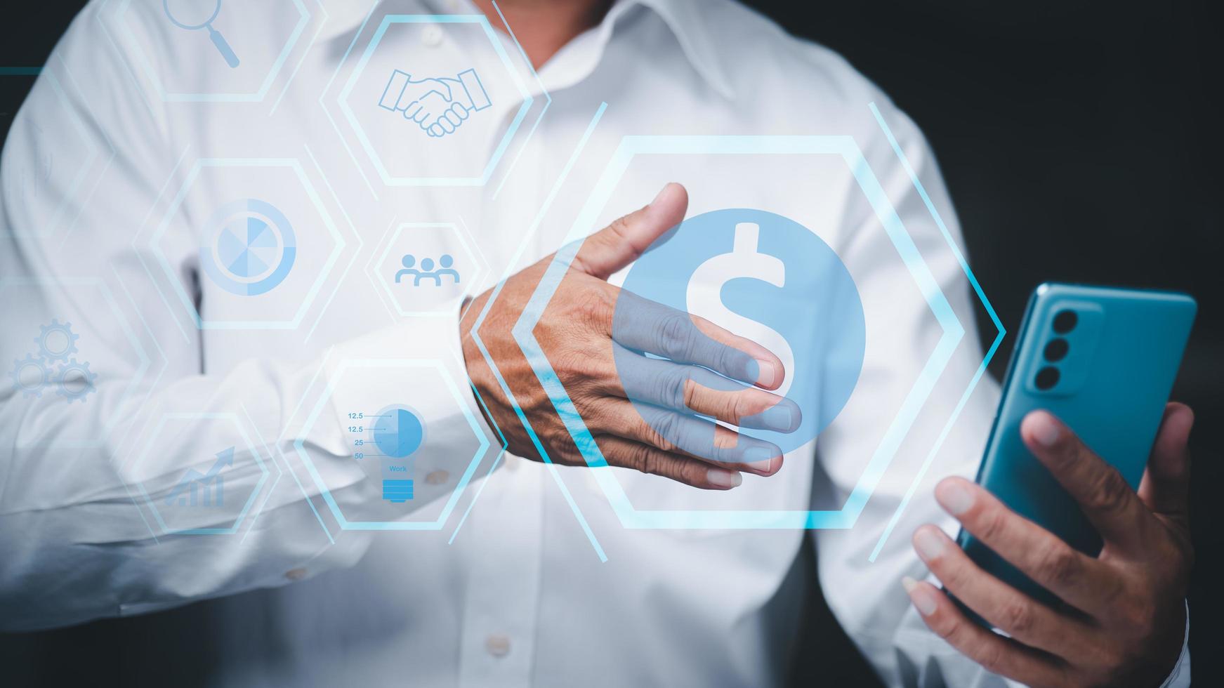Entrepreneurs show success by asking for a handshake through a phone screen, venture capital and financing ideas, strategic cooperation to plan teamwork. photo