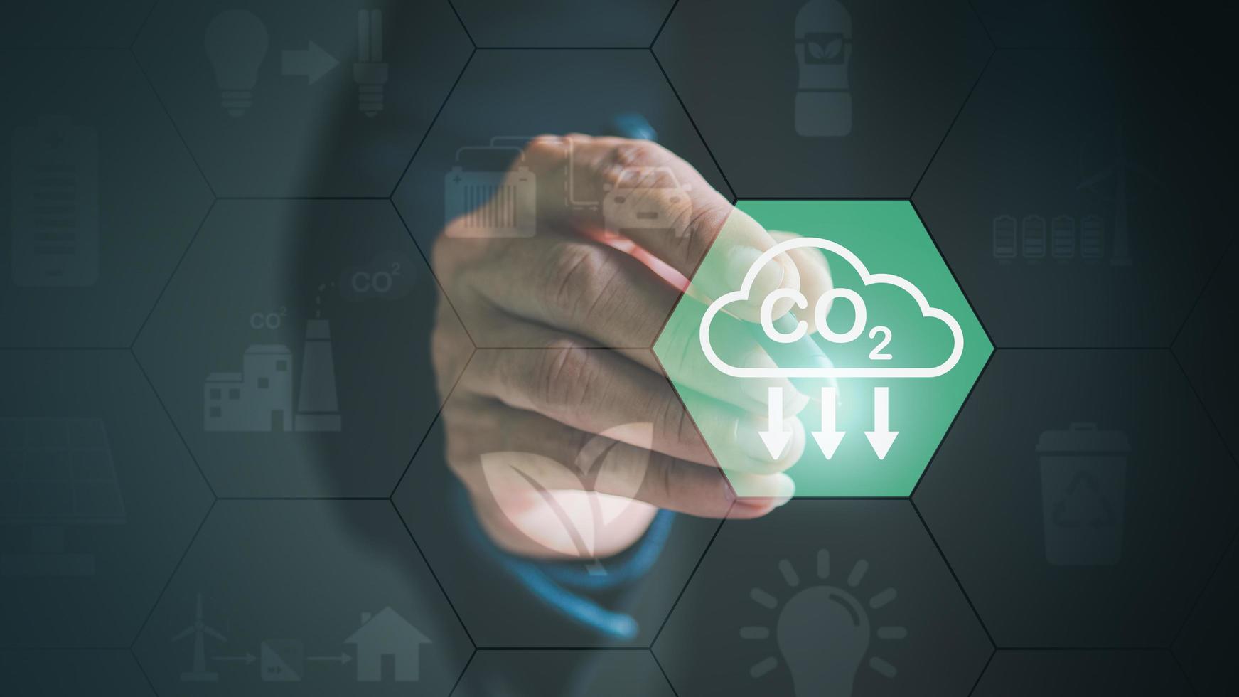 Industrial emissions pollute the environment and ecosystems. including climate change Carbon Renewable Energy Agreement reduce greenhouse gas emissions ,Businessman pointing at an icon with a pen photo