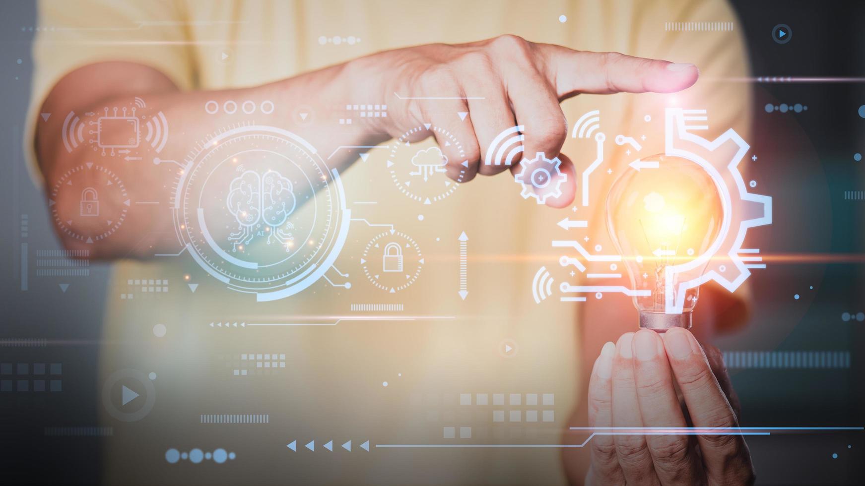 business man holding light bulb and virtual icon in hand, artificial intelligence future innovation concept, cloud computing network technology with huge database connected globally, photo