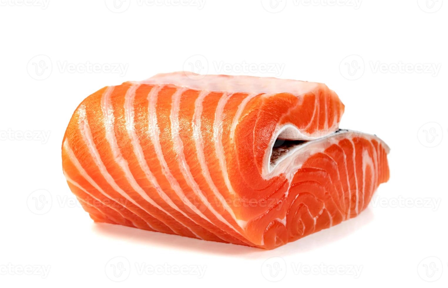 Piece of fresh salmon fillet sliced isolated on white background photo