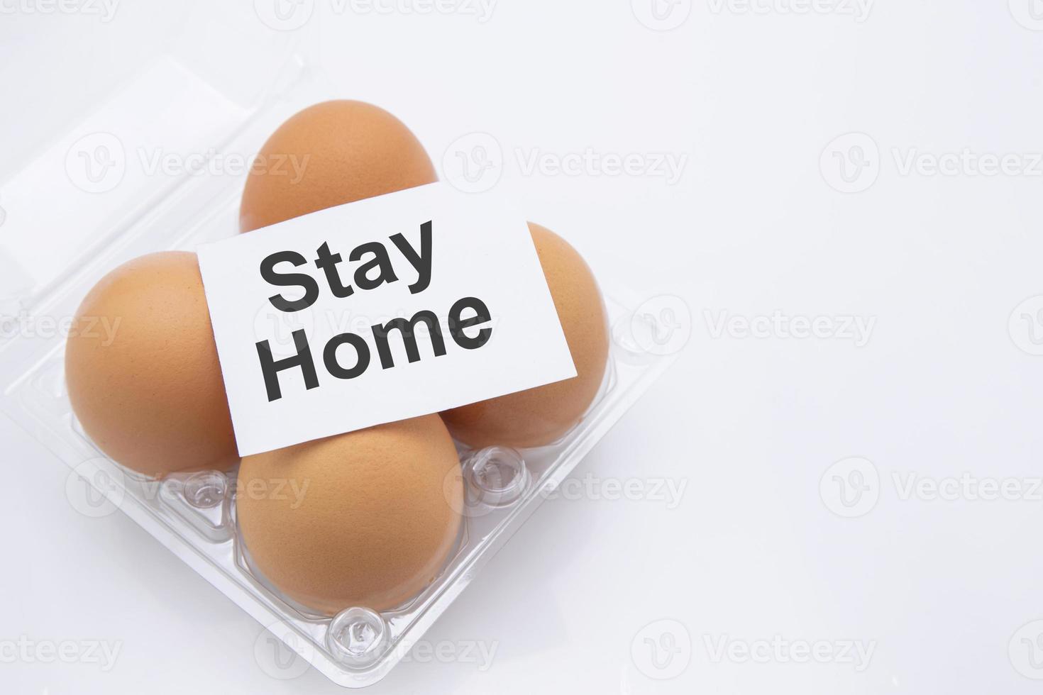 Easter egg with text stay home for protective covid-19 isolated on white background, social distancing and quarantine, stocking up on food for while pandemic coronavirus, easter day concept. photo