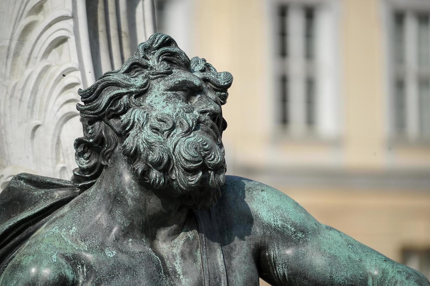 Berlin, germany, 2014. One of the four chained warriors at the base of King Frederic the Great statue Charlottenburg Palace in Berlin photo