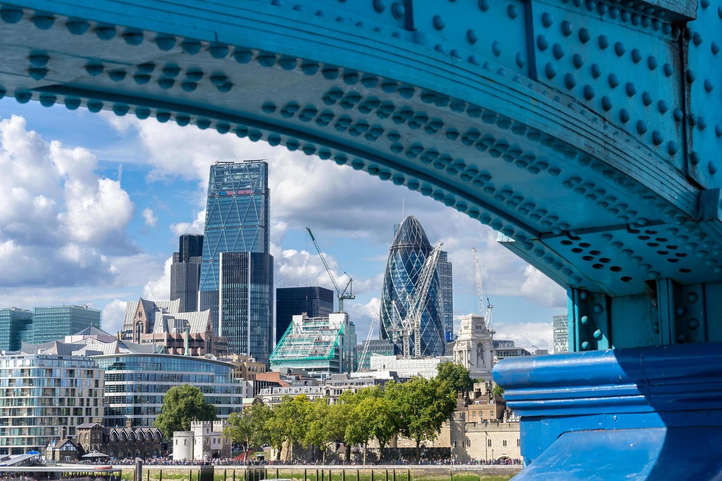 LONDON, UK - AUGUST 22. View of modern architecture in the City from underneath Tower Bridge in London on August 22, 2014. Unidentified people photo