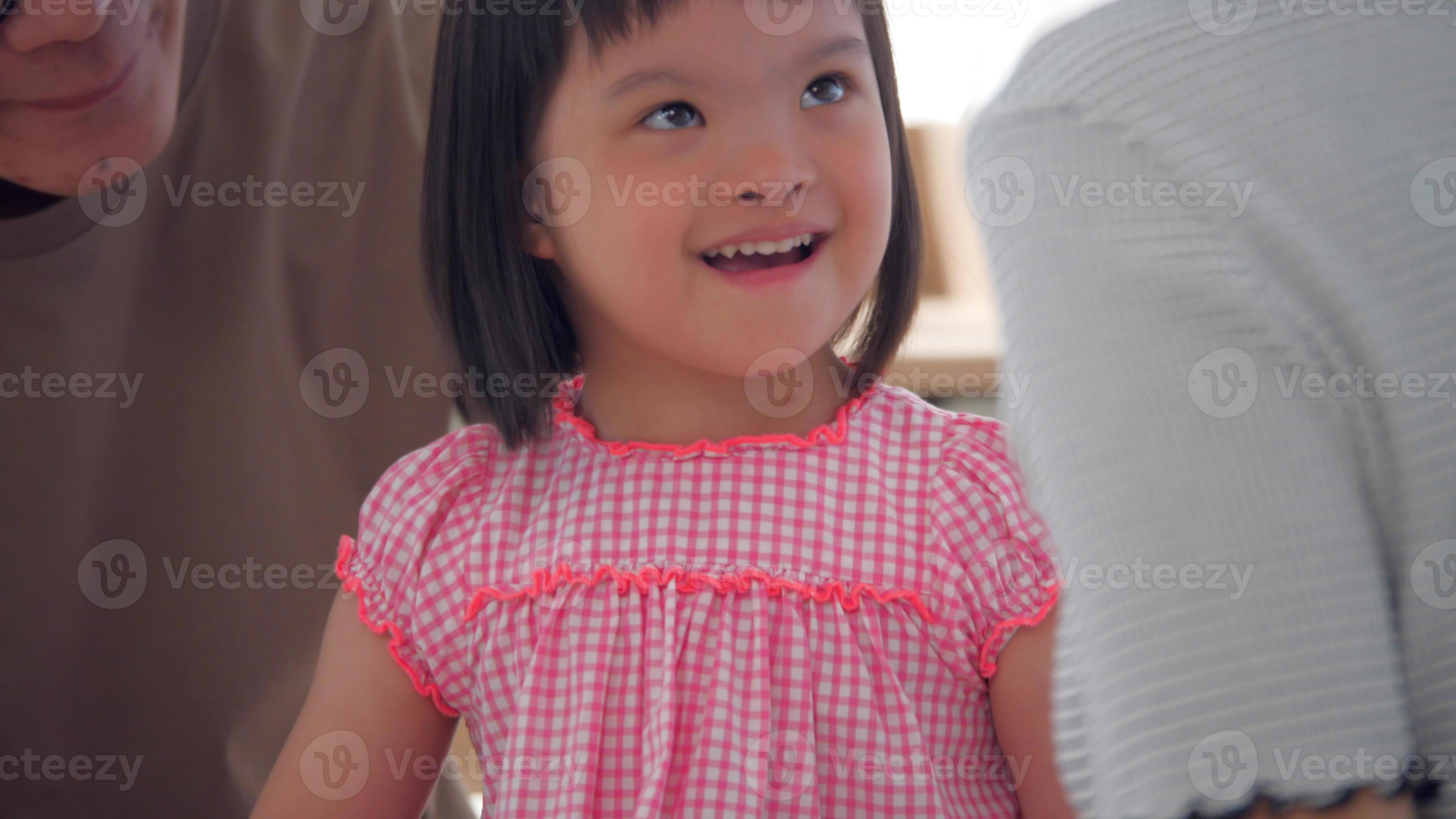 Happy family with mother, father and disabled daughter spending time