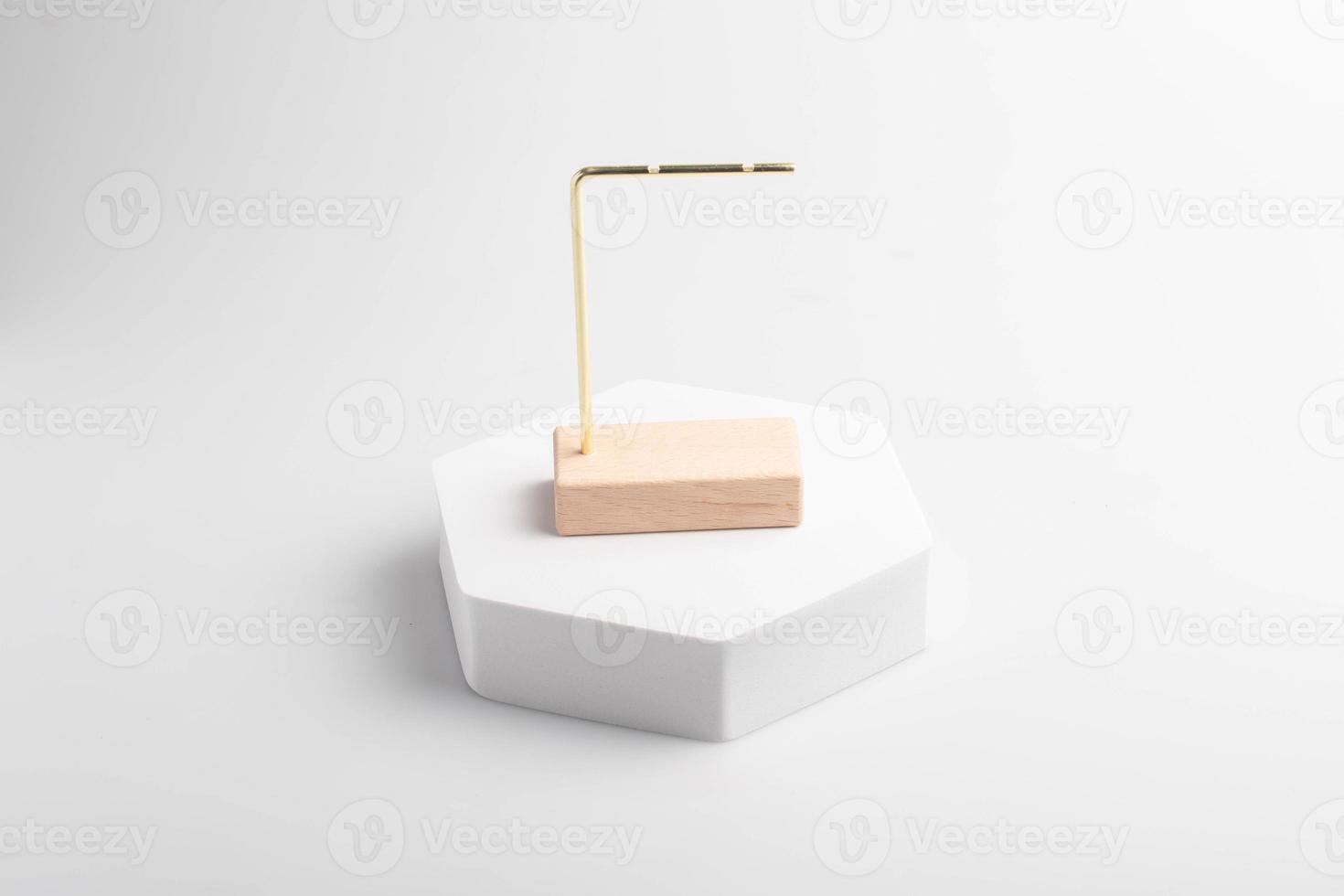 White product stand, mock up on a white background texture background Ideal backdrop for product presentations, exhibitions and mockups. photo