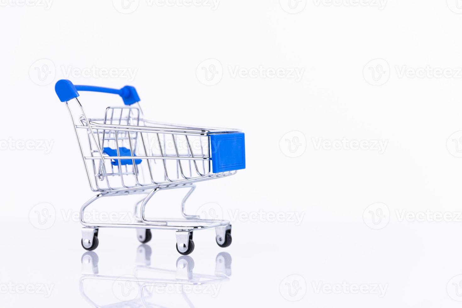 Shopping trolley, supermarket trolley on a white background. Copy space. photo