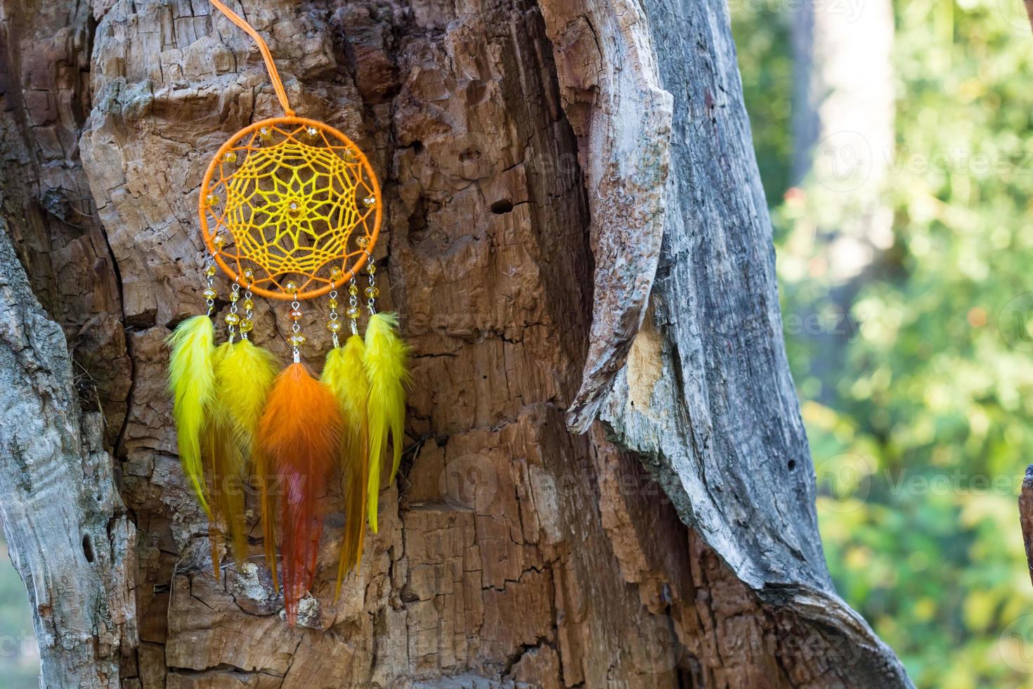 Handmade dream catcher with feathers threads and beads rope hanging photo