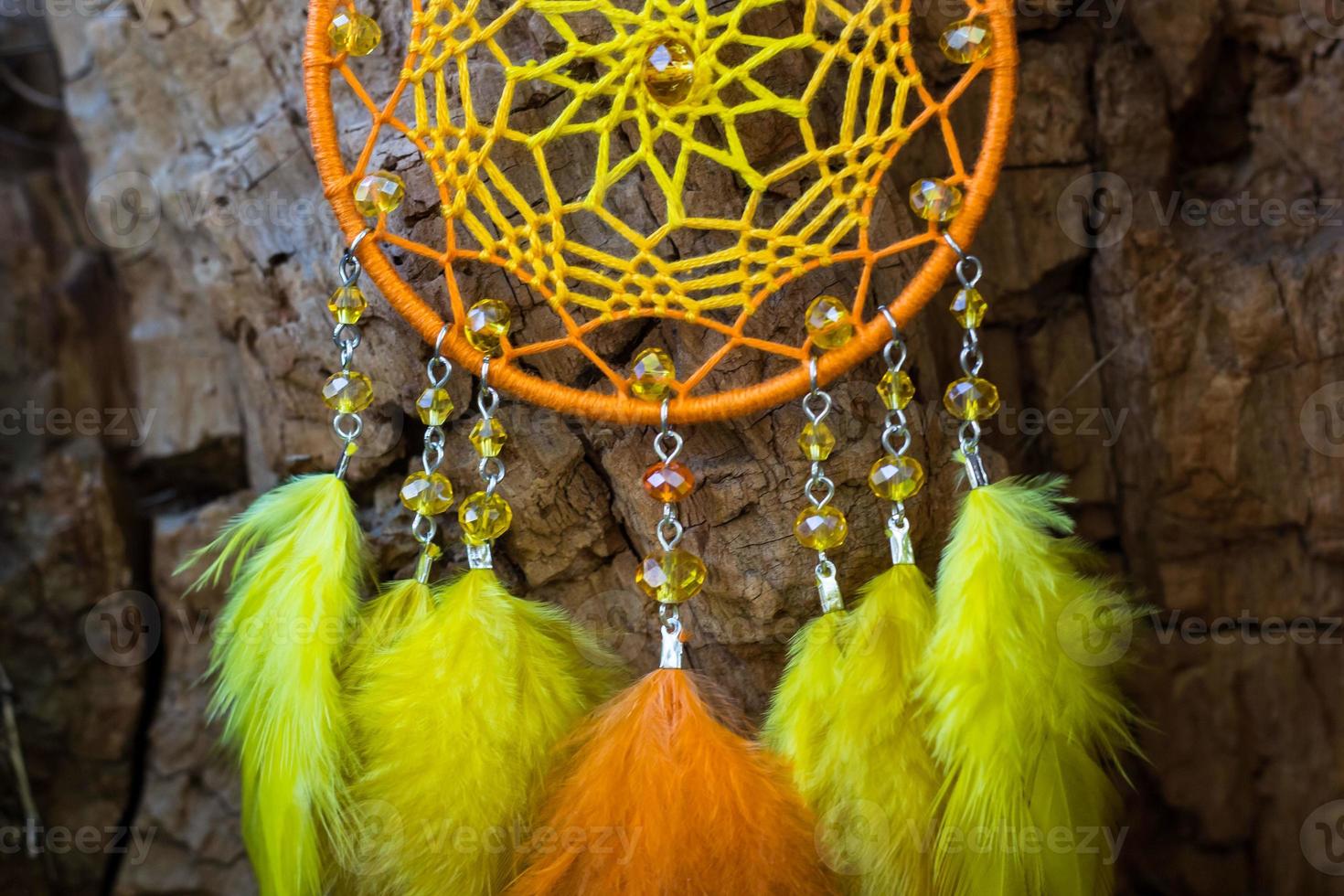 Handmade dream catcher with feathers threads and beads rope hanging photo