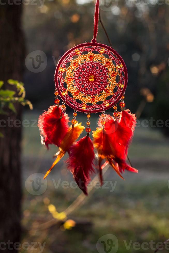 Handmade dream catcher with feathers threads and beads rope hanging photo