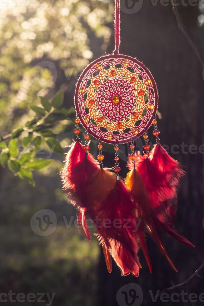 Handmade dream catcher with feathers threads and beads rope hanging photo