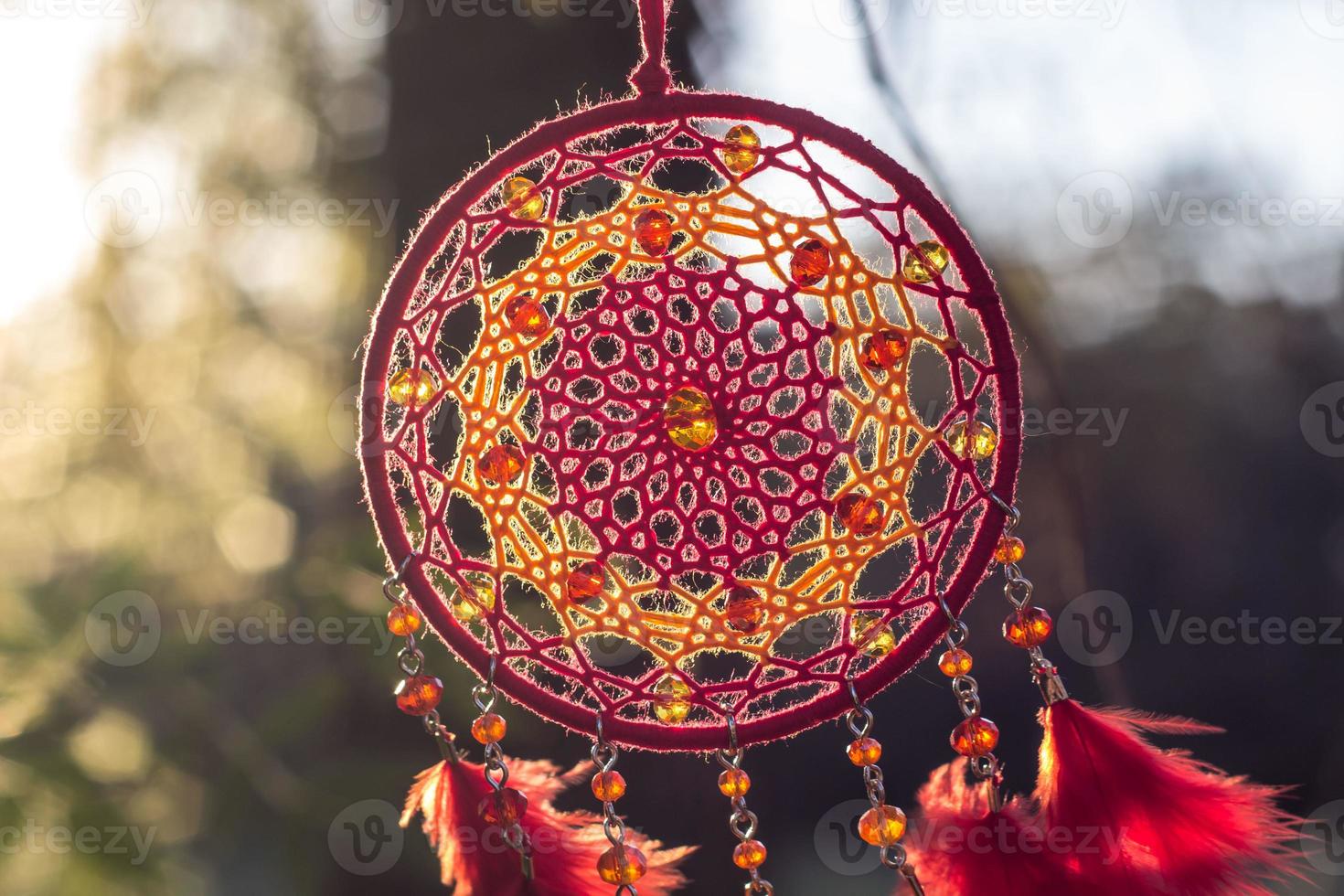 Handmade dream catcher with feathers threads and beads rope hanging photo