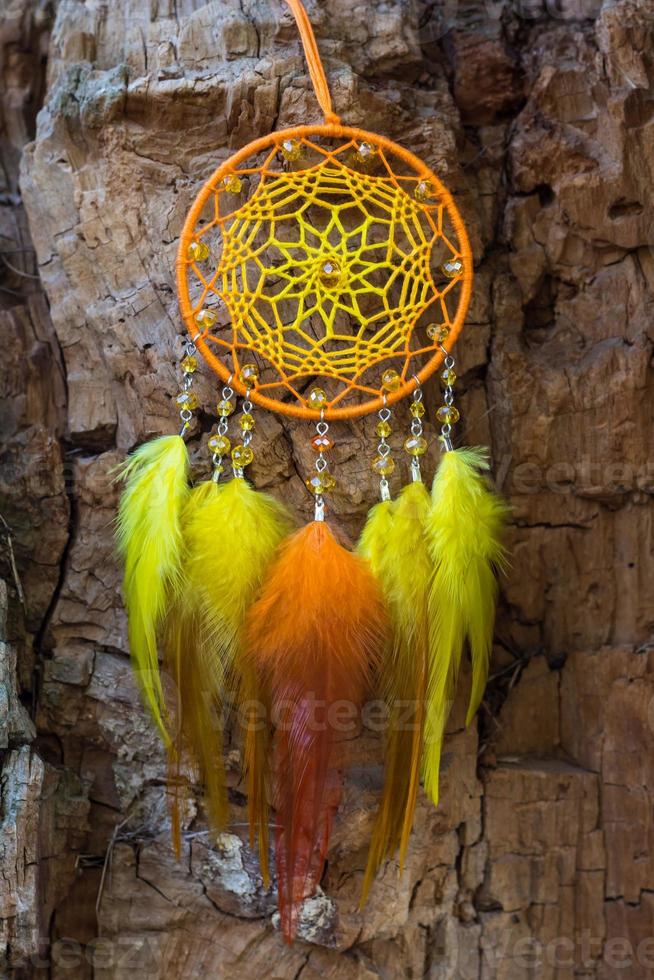 Handmade dream catcher with feathers threads and beads rope hanging photo