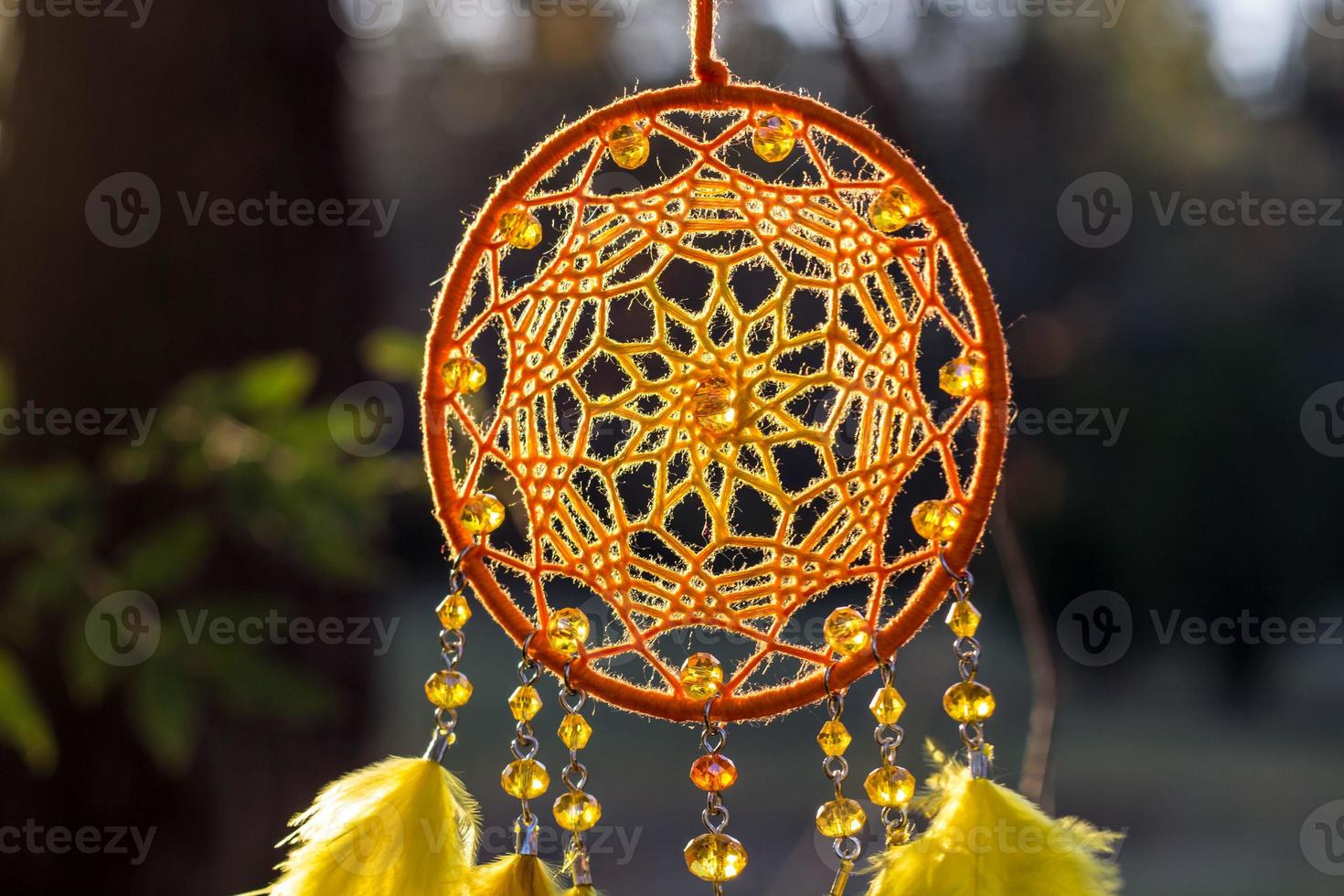 Handmade dream catcher with feathers threads and beads rope hanging photo