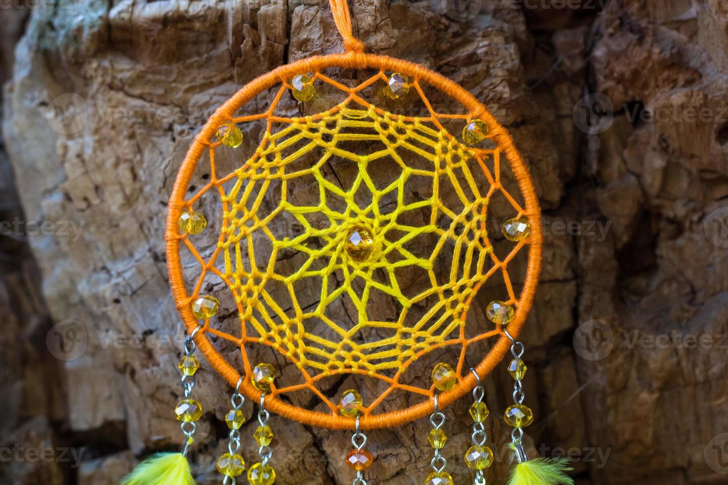 Handmade dream catcher with feathers threads and beads rope hanging photo