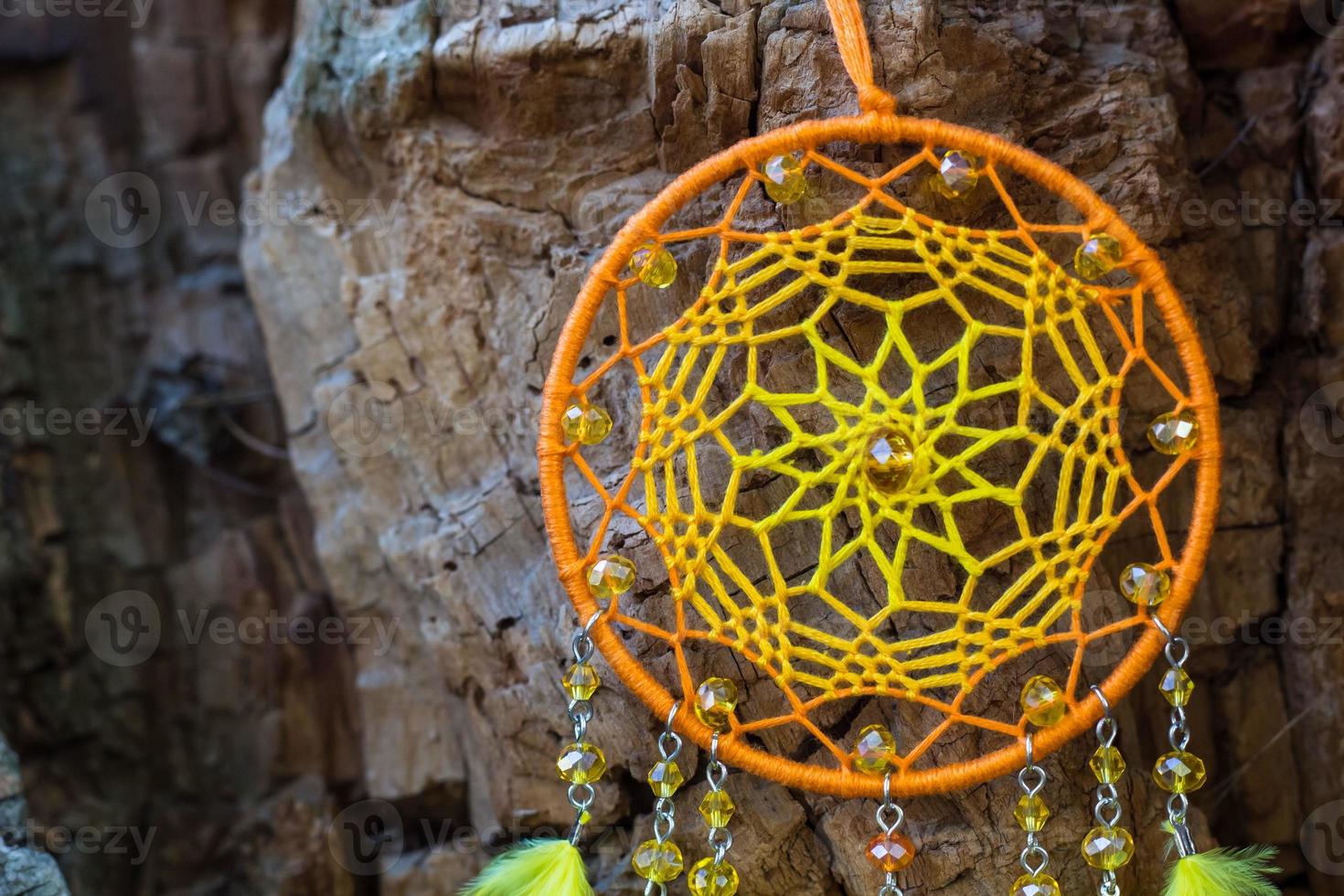 Handmade dream catcher with feathers threads and beads rope hanging photo