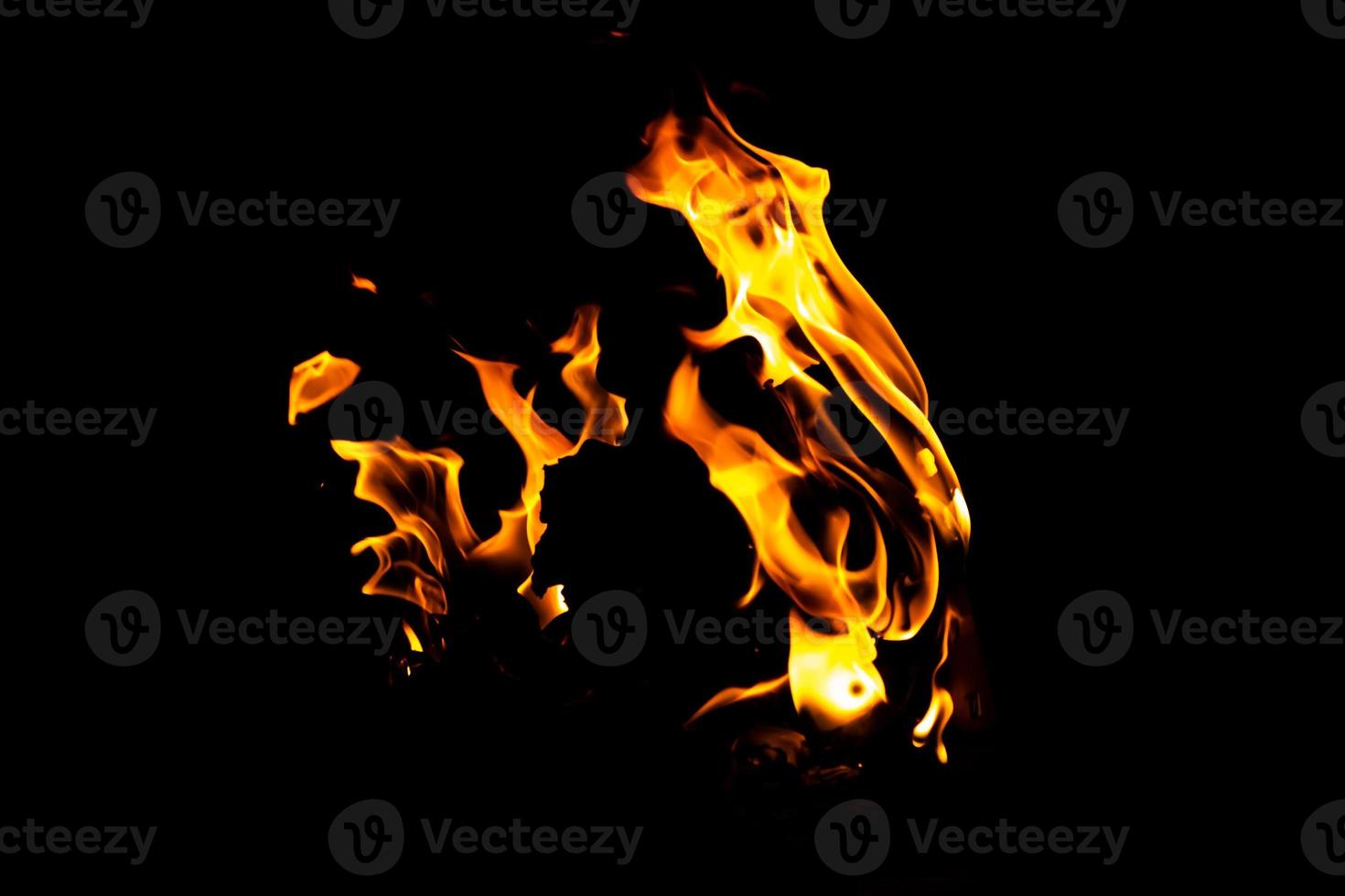 Fire flame texture. Burning material backdrop. Burn effect pattern. Blaze and torch wallpaper. Heat and haze backdrop. photo