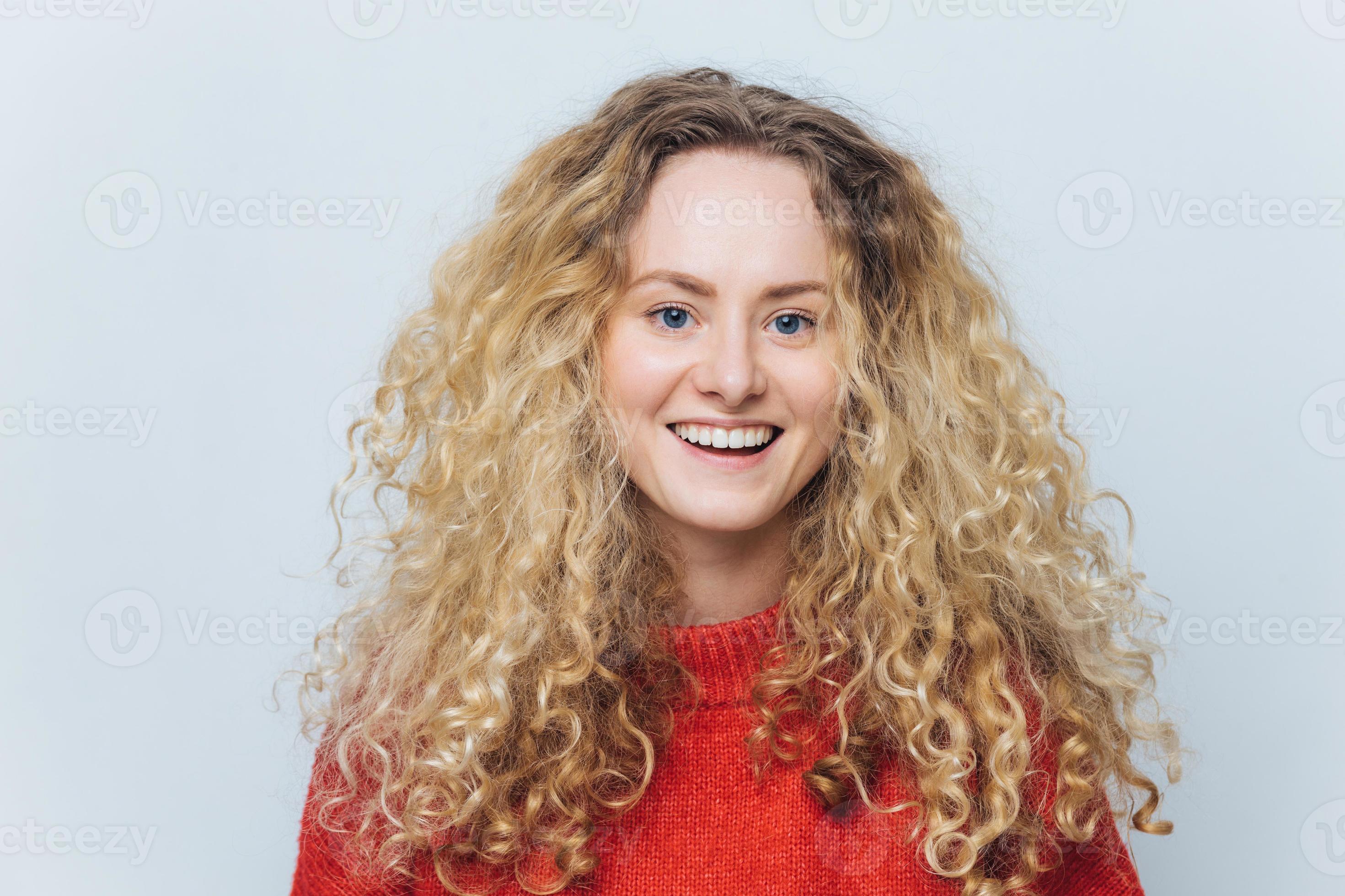 girl with curly blonde hair and blue eyes