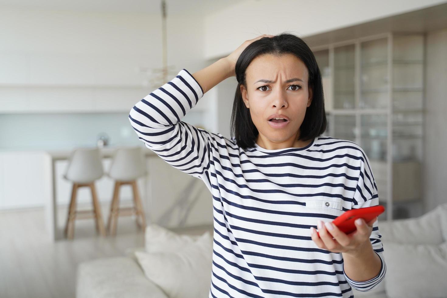 Girl gets problem with phone. Worried woman gets unhappy news in message. Lady getting in trouble. photo