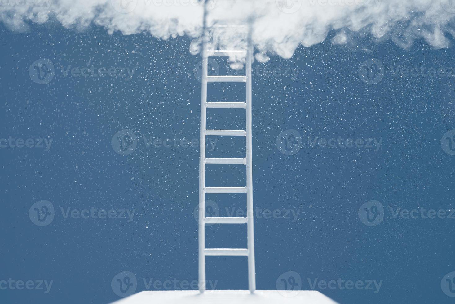 Ladder reaching into a blue sky and clouds. The concept of the path to success. photo