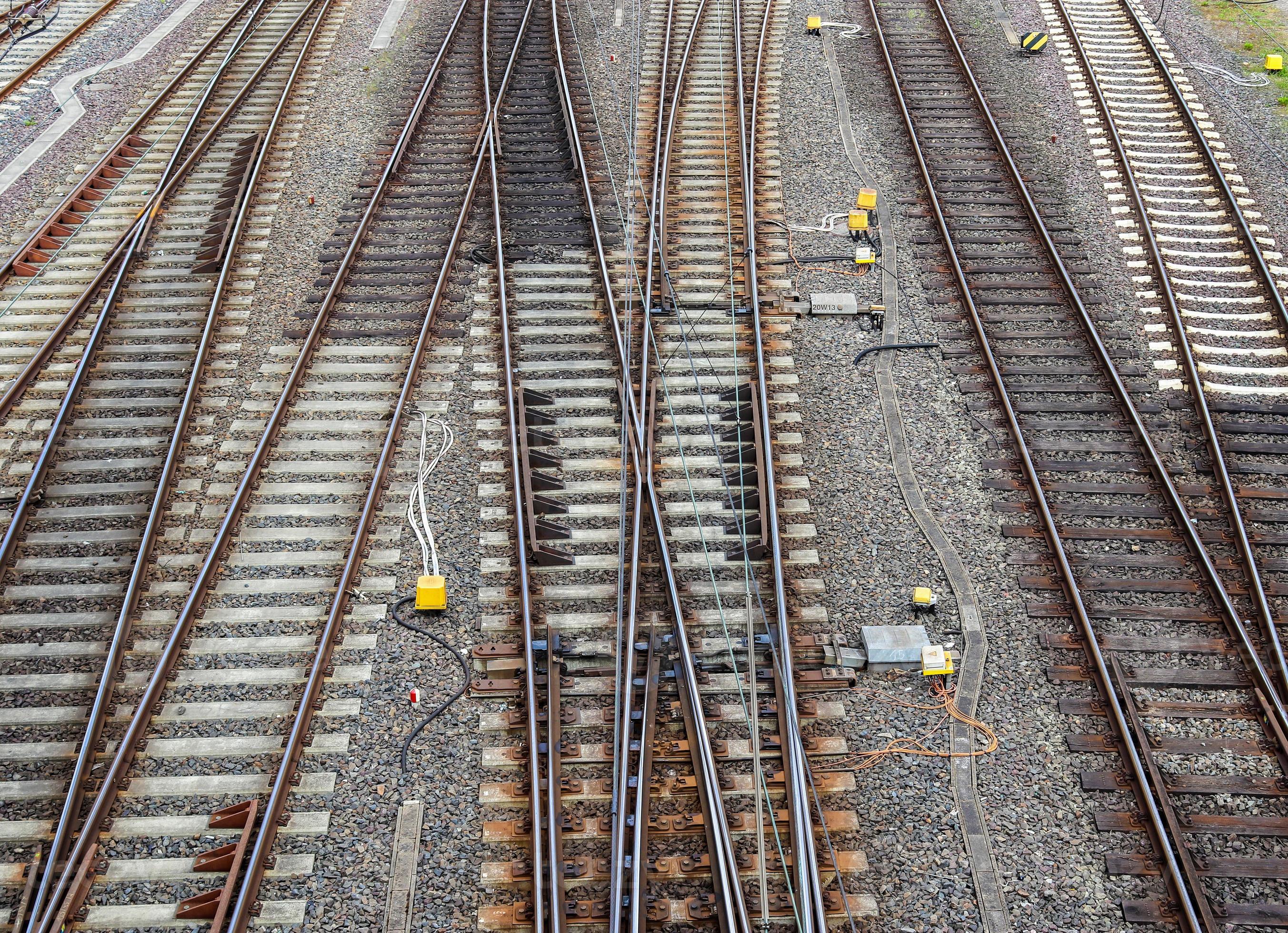 Multiple railroad tracks with junctions at a railway station in a