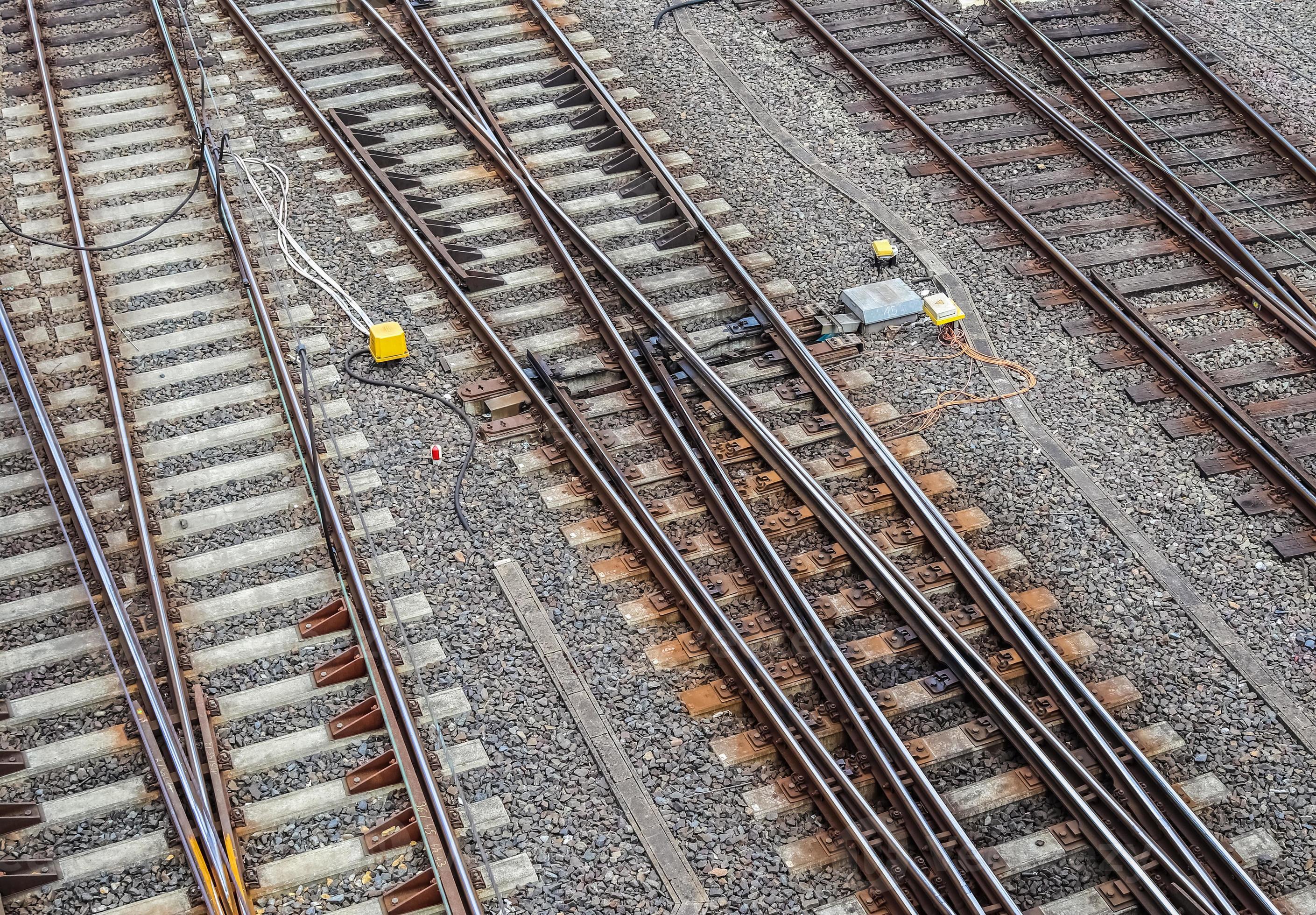 Multiple railroad tracks with junctions at a railway station in a