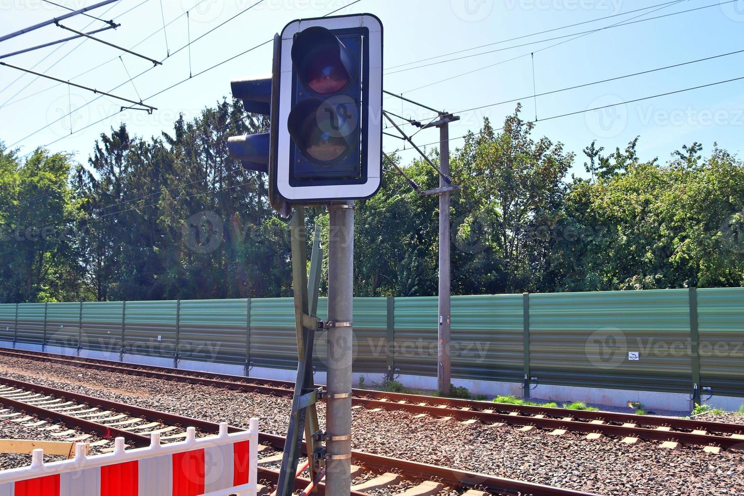 Multiple railroad tracks with junctions at a railway station in a perspective and birds view photo