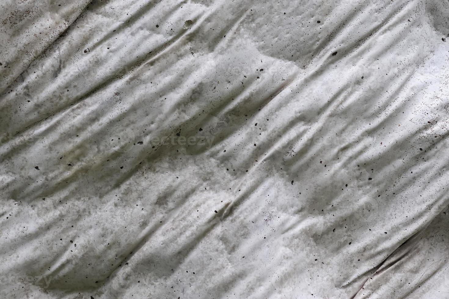 Close up view at the surface of a white marble stone. photo