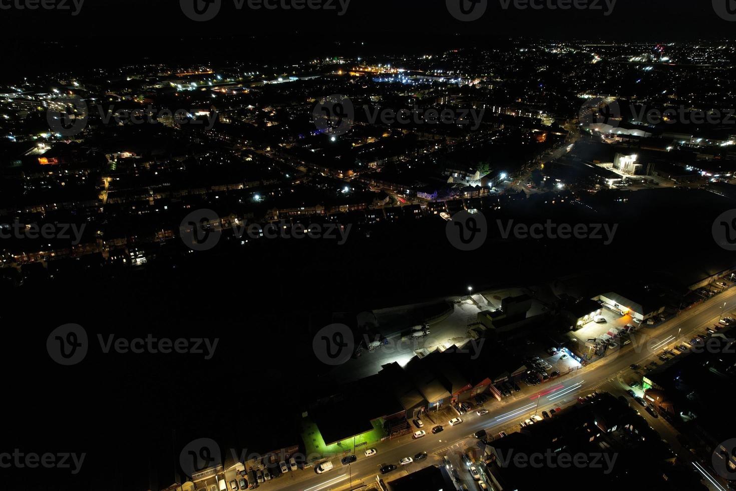 Night Aerial View of Illuminated British City. Drone's Footage of Luton Town of England at Night photo