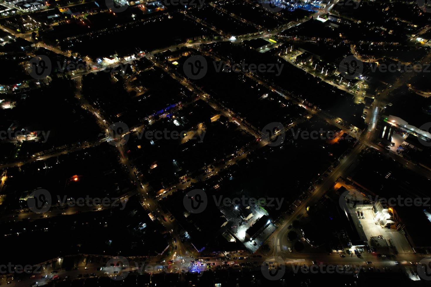 Night Aerial View of Illuminated British City. Drone's Footage of Luton Town of England at Night photo
