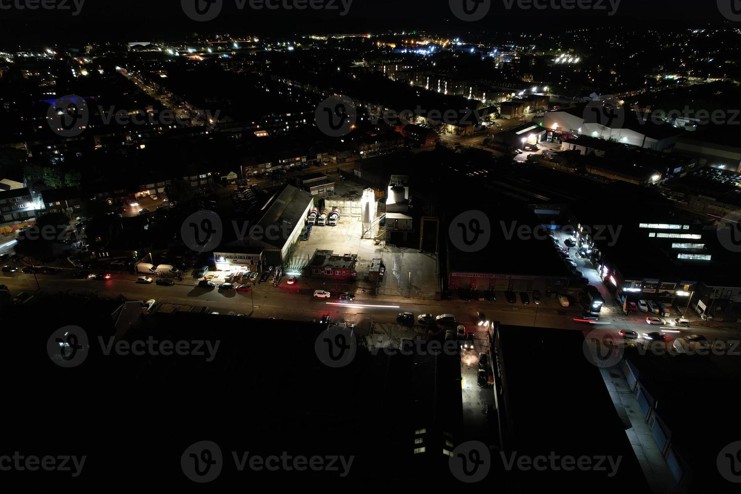 Night Aerial View of Illuminated British City. Drone's Footage of Luton Town of England at Night photo