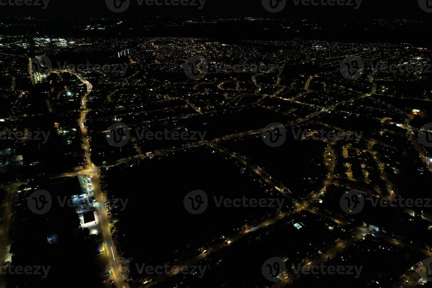 Night Aerial View of Illuminated British City. Drone's Footage of Luton Town of England at Night photo