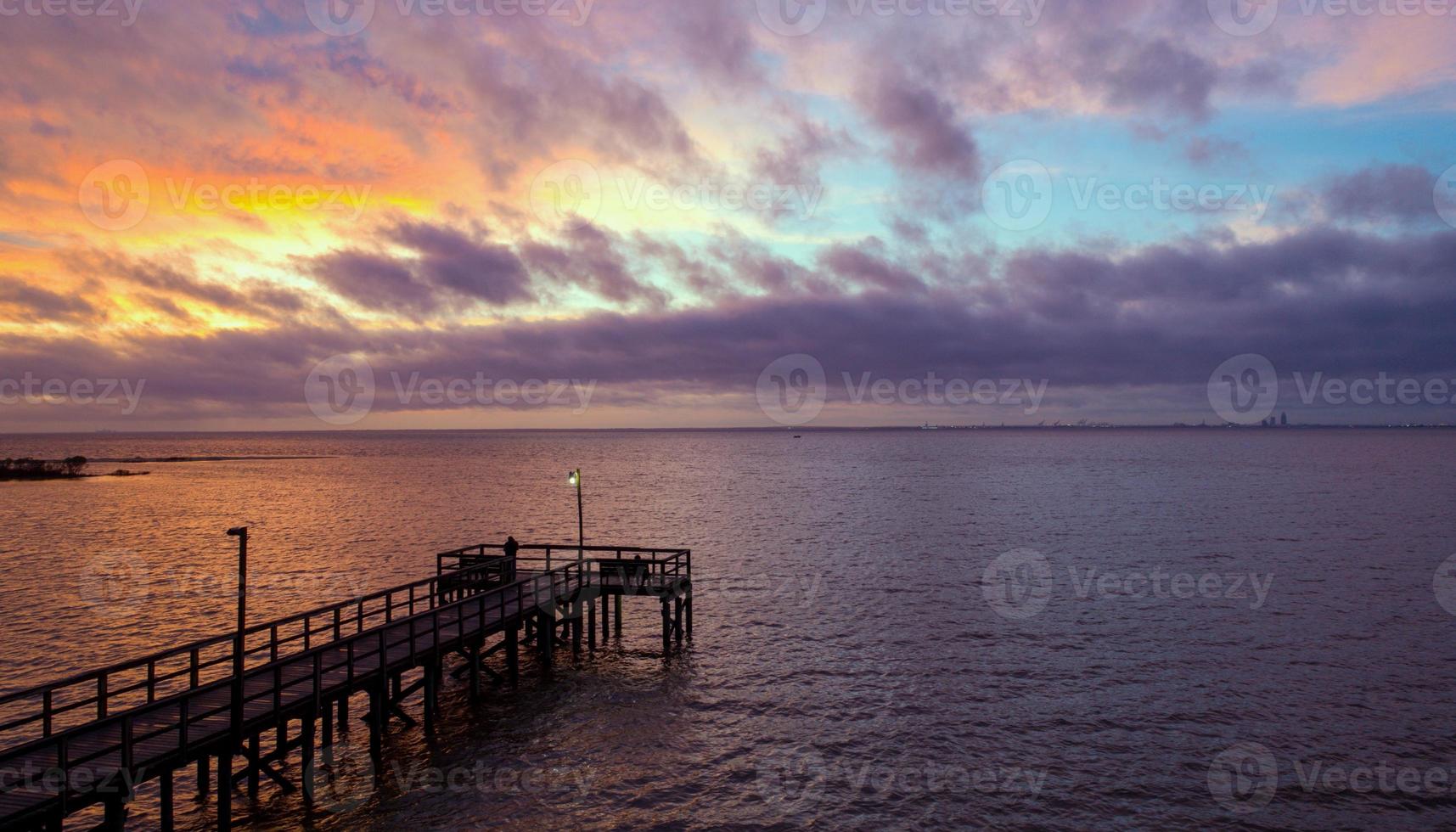 Pier on Mobile Bay at sunset photo