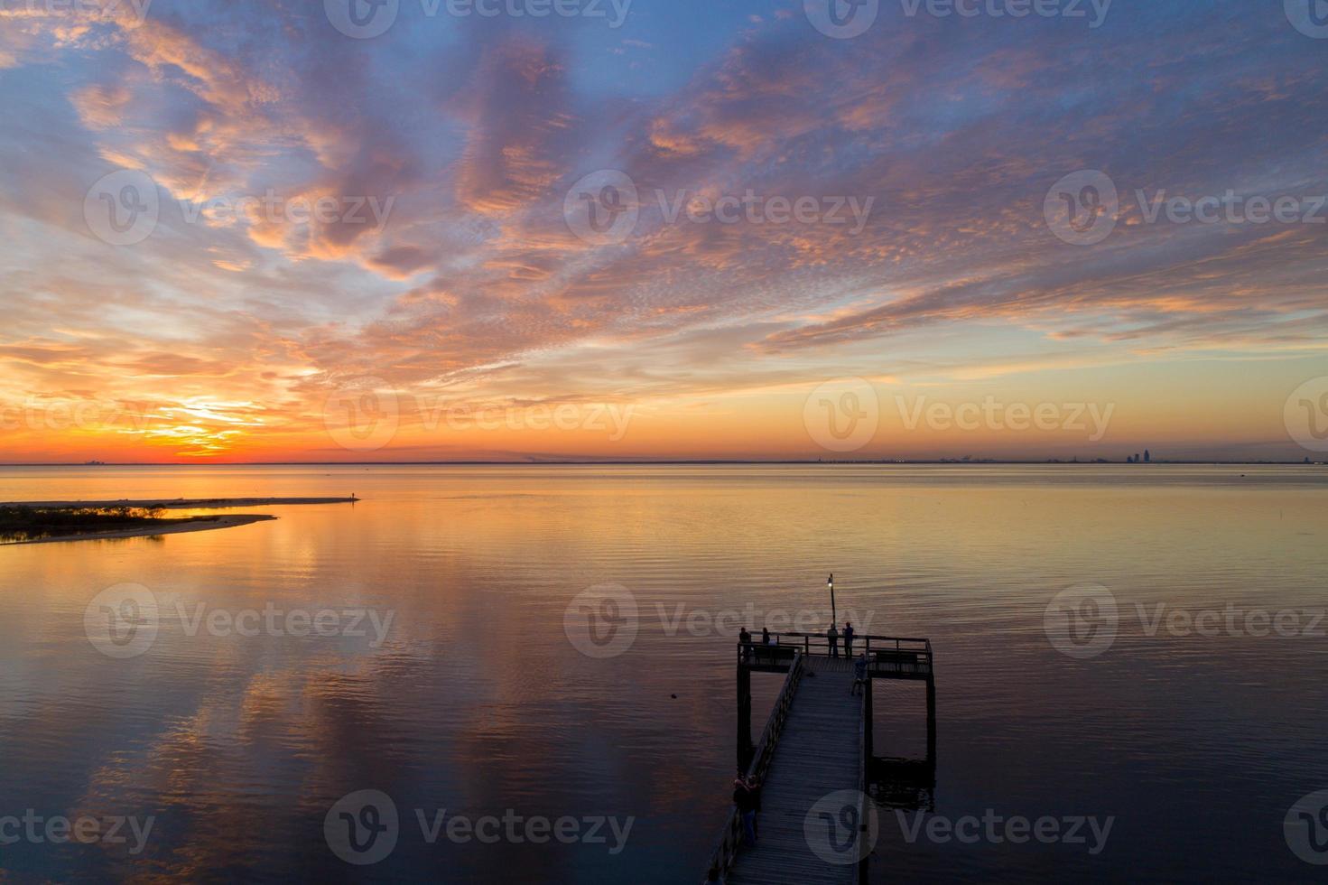 Pier on Mobile Bay at sunset photo