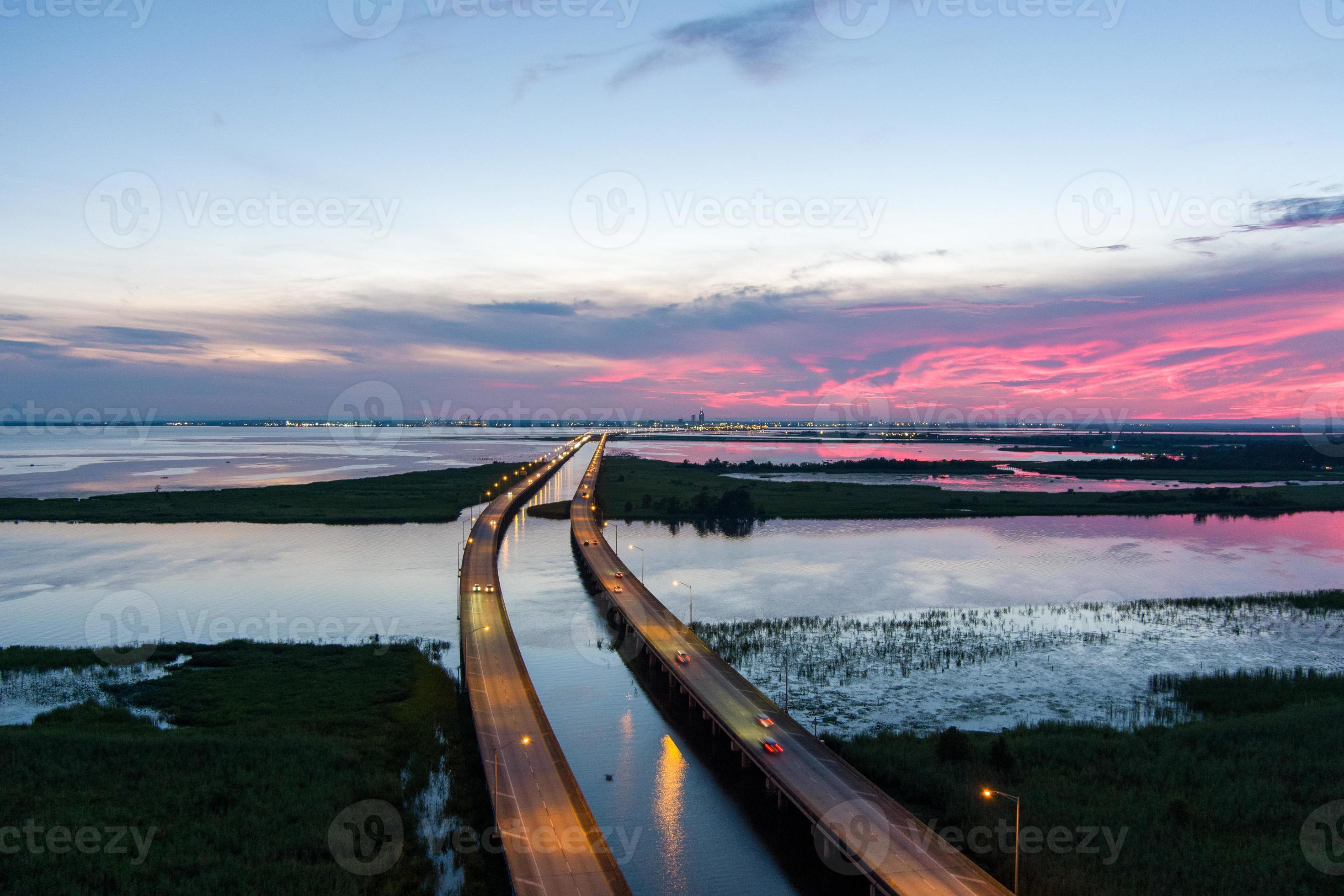 Aerial view of Mobile Bay and Jubilee Parkway bridge at sunset on the 