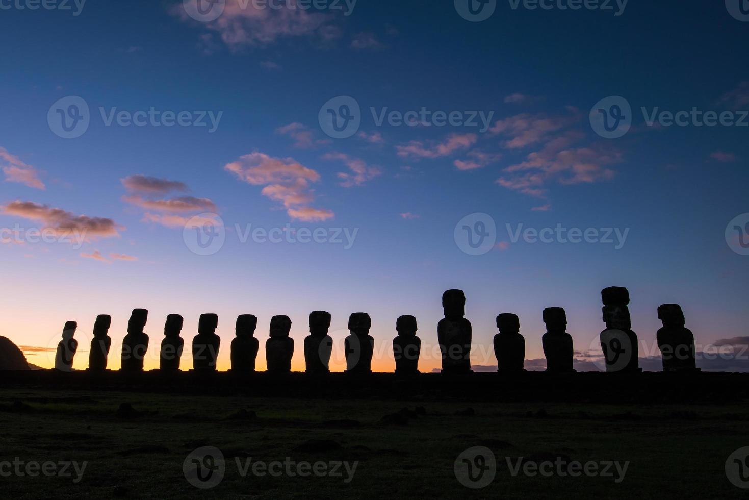 Silhouette shot of Moai statues in Easter Island photo