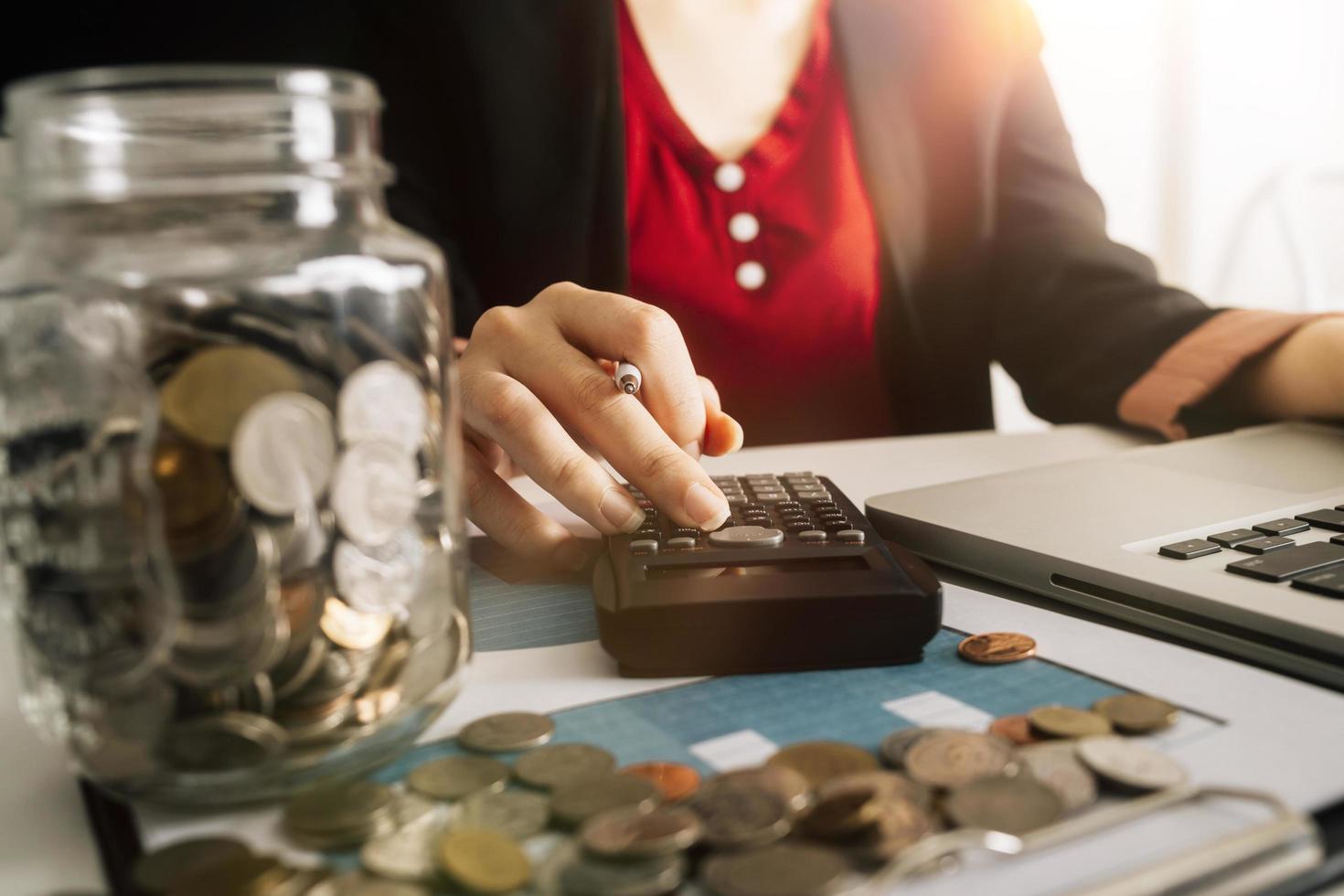 Business accounting concept, Business man using calculator with computer laptop, budget and loan paper in office. photo