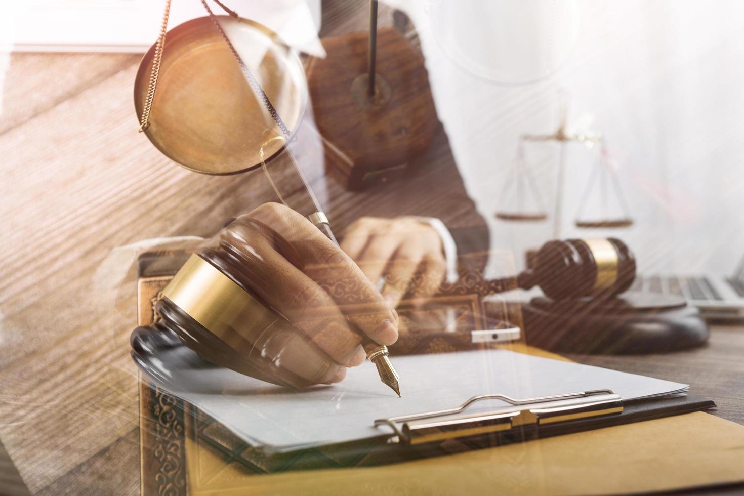 Business and lawyers discussing contract papers with brass scale on desk in office. Law, legal services, advice, justice and law concept picture with film grain effect photo
