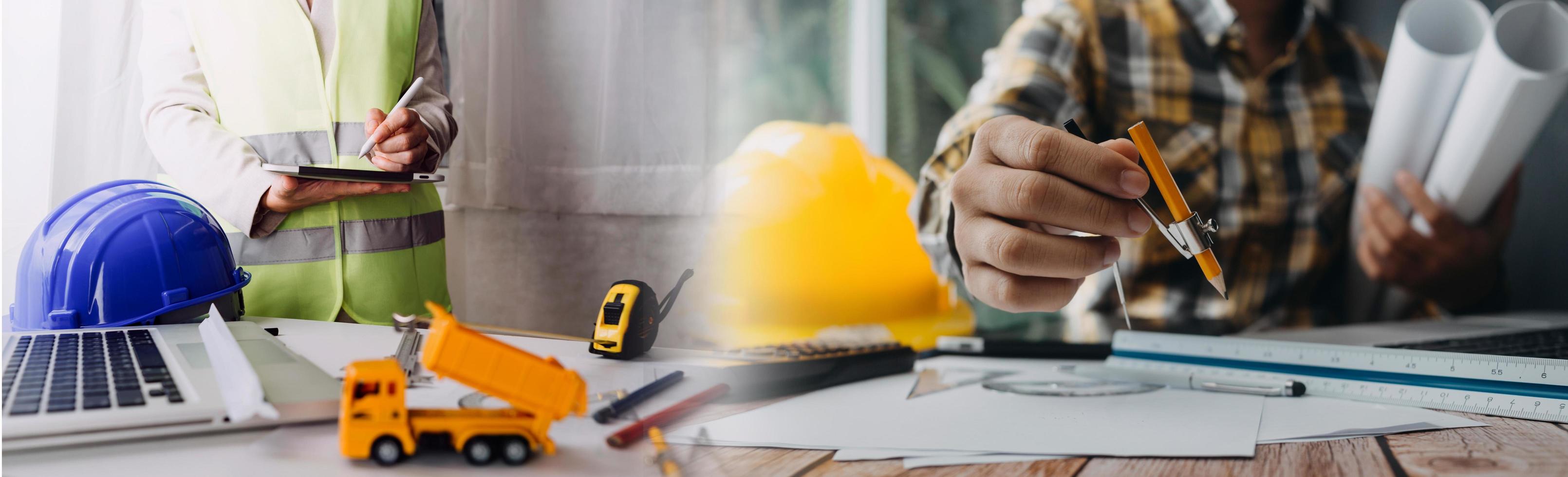 Two colleagues discussing data working and tablet, laptop with on on architectural project at construction site at desk in office photo